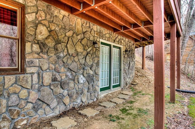 view of side of property with french doors