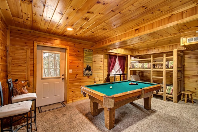 recreation room with carpet flooring, wood walls, and pool table