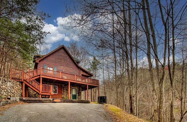 exterior space featuring a wooden deck