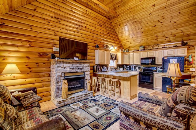 living room with rustic walls, sink, high vaulted ceiling, a fireplace, and wood ceiling