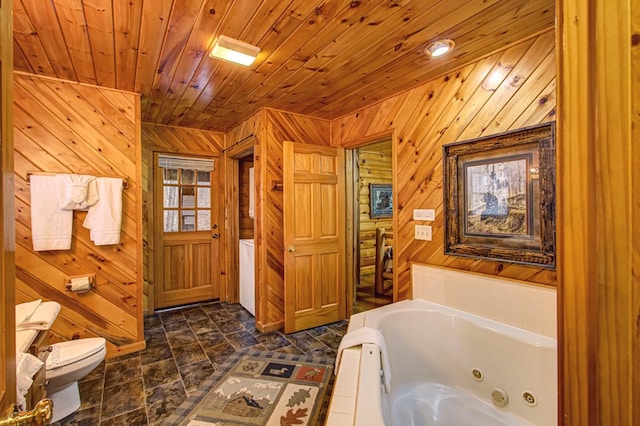 bathroom with wooden ceiling, a tub to relax in, toilet, and wooden walls