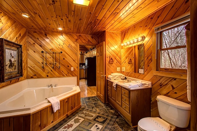 bathroom with a bathtub, vanity, wood ceiling, and toilet