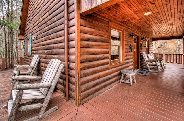 wooden terrace featuring covered porch