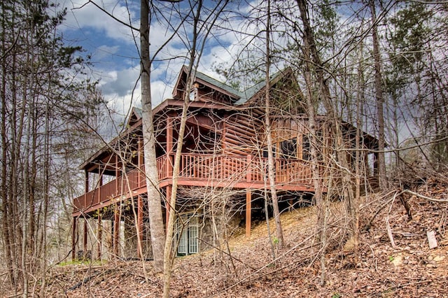 back of property featuring a deck