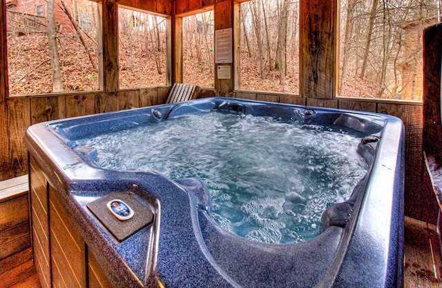 exterior space with a hot tub