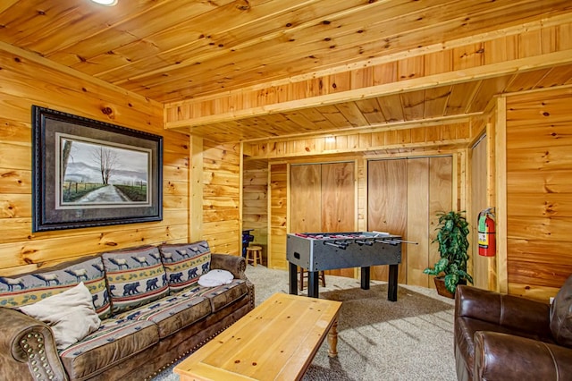 game room with carpet, beam ceiling, wooden walls, and wood ceiling