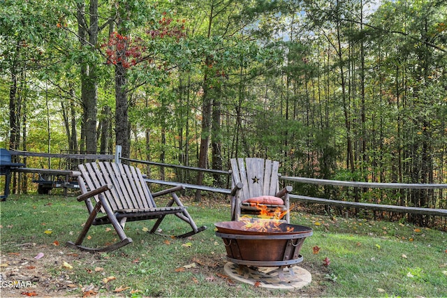 view of yard featuring an outdoor fire pit