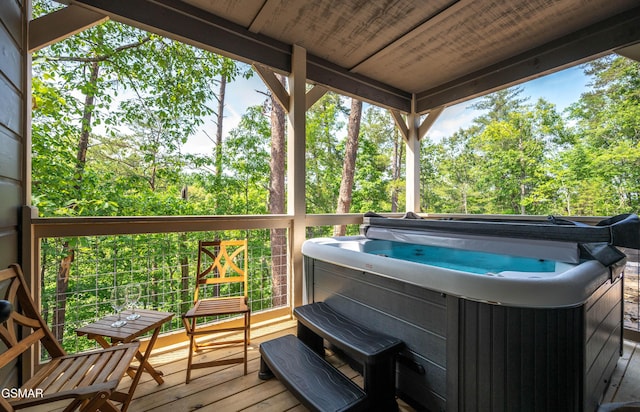 wooden terrace with a hot tub