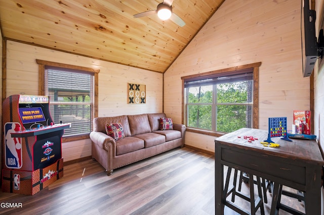 living room featuring lofted ceiling, hardwood / wood-style floors, wooden walls, and wooden ceiling