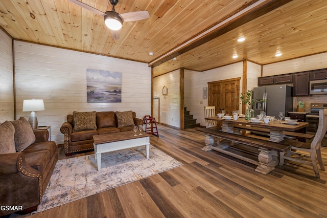 living room with hardwood / wood-style flooring, ceiling fan, wood ceiling, and wood walls