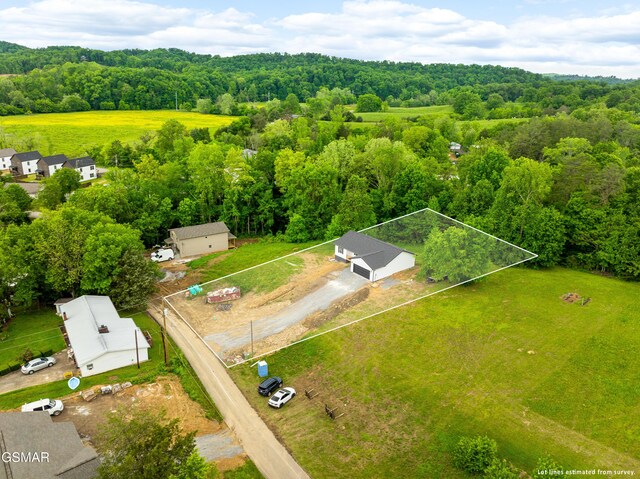 view of property location featuring a forest and property parcel outlined