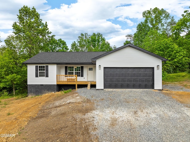 view of front facade with gravel driveway, a porch, an attached garage, and a shingled roof