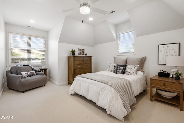 carpeted bedroom featuring multiple windows, vaulted ceiling, and ceiling fan