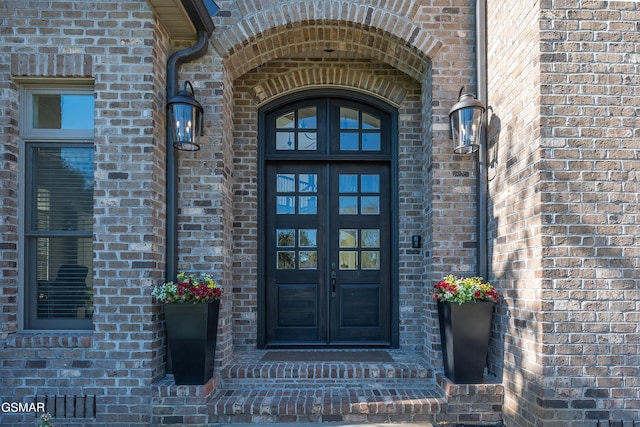 property entrance featuring french doors