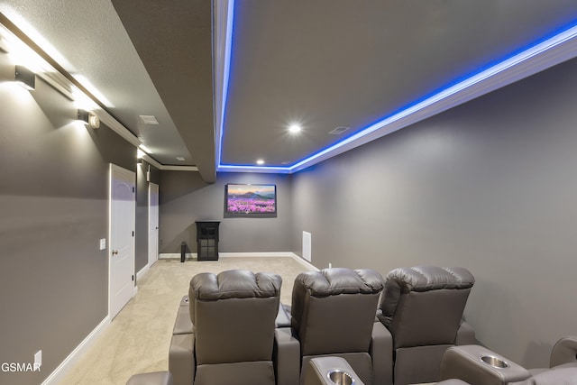 cinema room featuring light colored carpet and ornamental molding