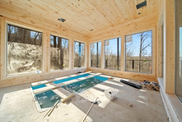 unfurnished sunroom featuring wooden ceiling