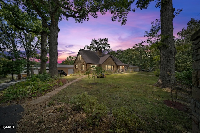 view of front of house with a yard