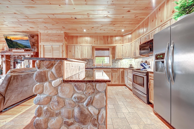 kitchen with a center island, light brown cabinetry, appliances with stainless steel finishes, wooden ceiling, and a kitchen breakfast bar