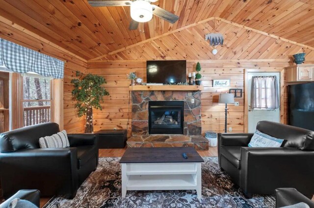 living room with lofted ceiling, wood walls, and wooden ceiling