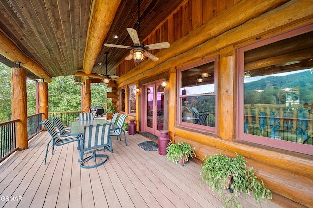 wooden deck with ceiling fan and a porch