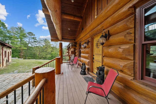 wooden deck featuring covered porch