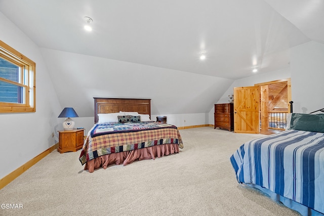 bedroom featuring carpet and vaulted ceiling