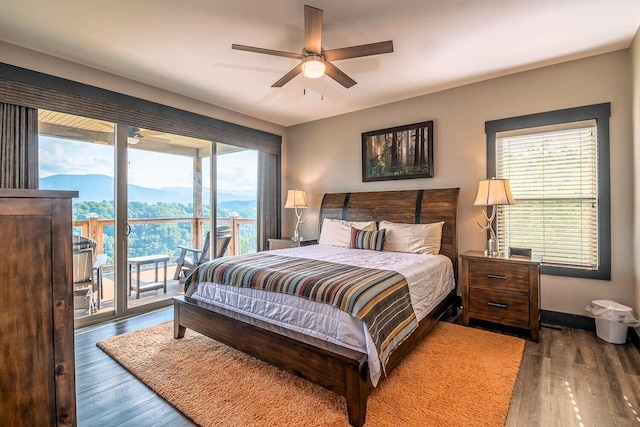 907 Village Loop Rd, Gatlinburg, TN 37738 - bedroom featuring access to exterior, a mountain view, ceiling fan, and dark hardwood / wood-style floors