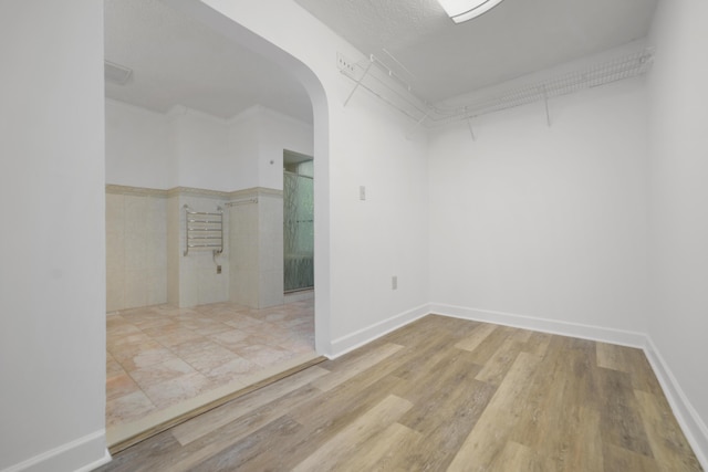 spare room with wood-type flooring