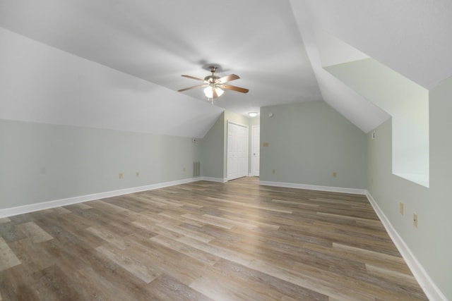 bonus room featuring hardwood / wood-style floors, ceiling fan, and lofted ceiling