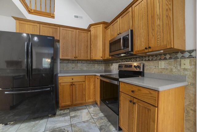 kitchen with backsplash, light tile patterned flooring, stainless steel appliances, and vaulted ceiling