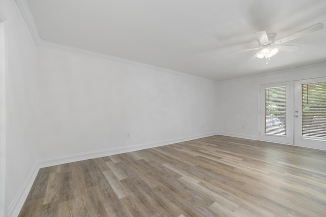 unfurnished room featuring ceiling fan, french doors, light hardwood / wood-style floors, and ornamental molding