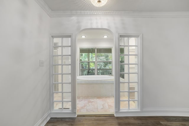 doorway featuring dark hardwood / wood-style flooring and ornamental molding