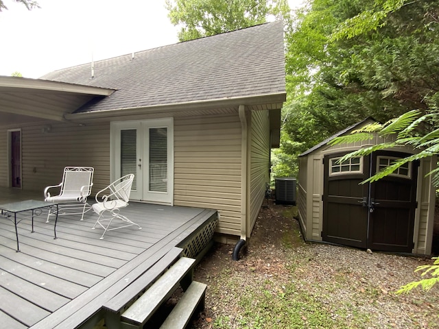 wooden deck featuring french doors and central air condition unit