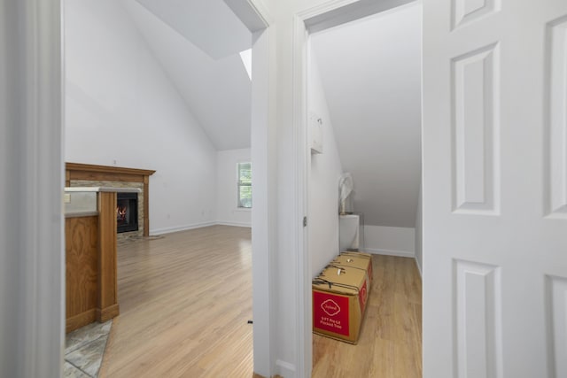 interior space featuring light hardwood / wood-style flooring and lofted ceiling