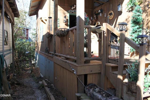 view of home's exterior featuring a wooden deck