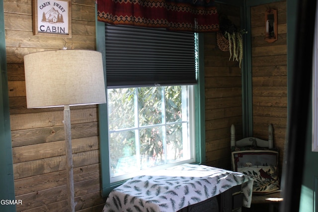 bedroom with wood walls