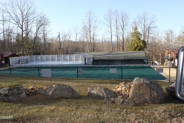 view of swimming pool with a fenced in pool and fence