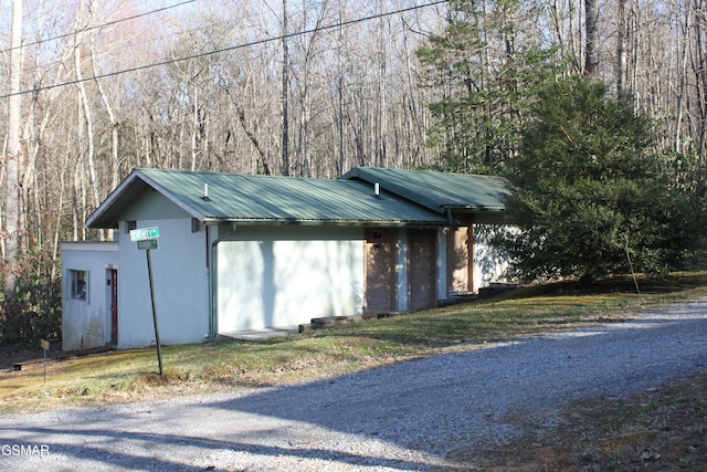 view of outdoor structure with a view of trees