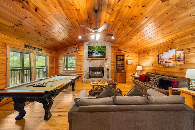 game room featuring wooden ceiling, a stone fireplace, light hardwood / wood-style flooring, vaulted ceiling, and pool table