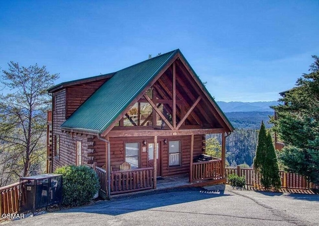 log cabin with a mountain view