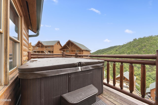 deck featuring a hot tub