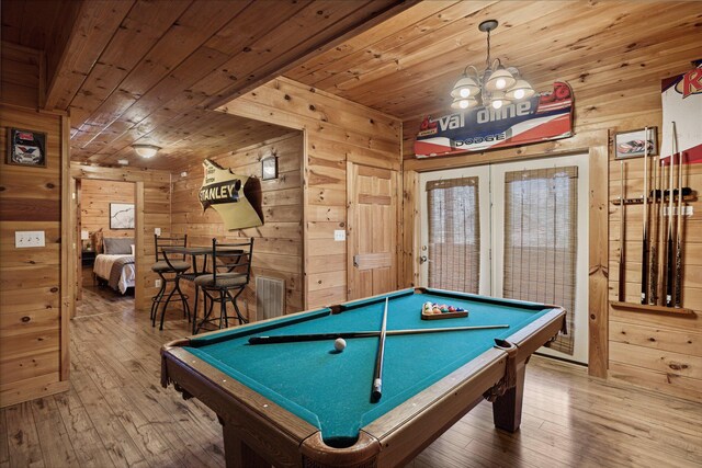 recreation room featuring wood walls and wooden ceiling