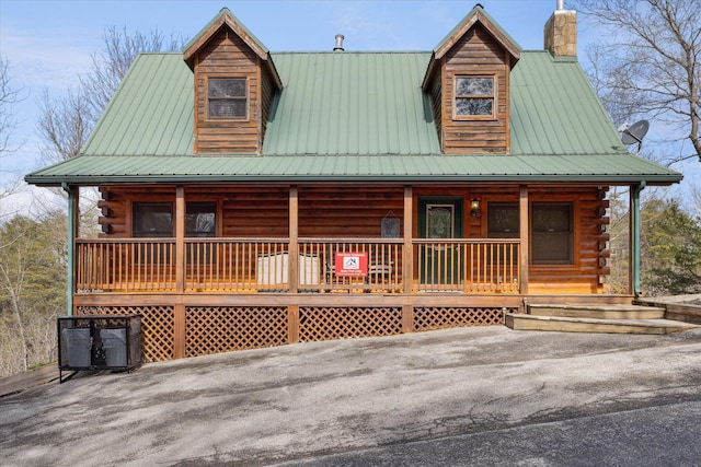 log-style house with a porch