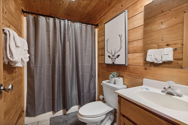 bathroom with wooden walls, vanity, and wooden ceiling