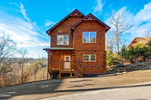 log-style house featuring log siding