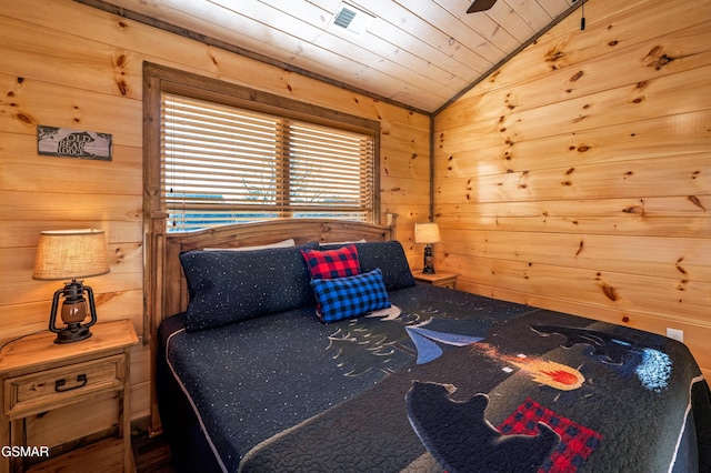 bedroom featuring wooden ceiling, visible vents, vaulted ceiling, and wood walls