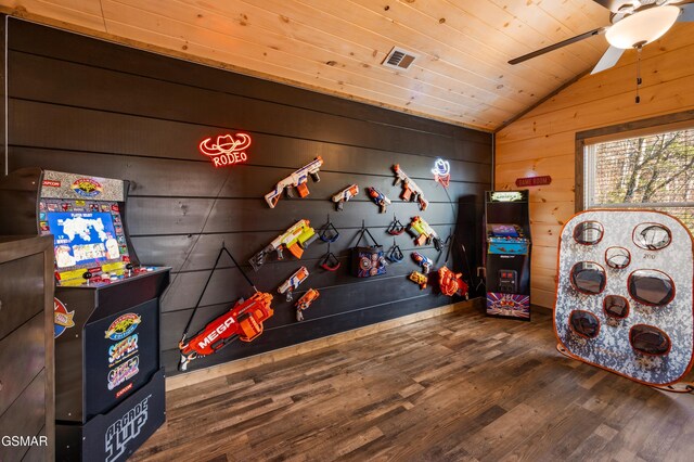 recreation room featuring visible vents, wooden ceiling, wood finished floors, vaulted ceiling, and wood walls