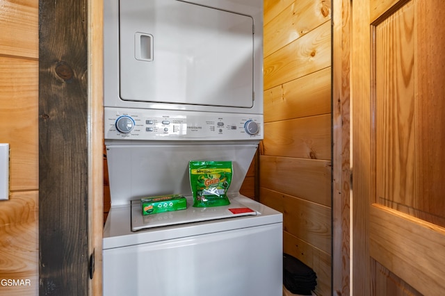 washroom featuring laundry area and stacked washing maching and dryer