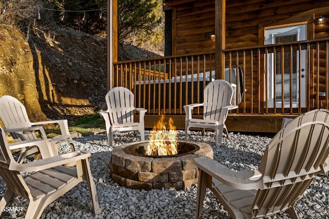 view of patio / terrace with an outdoor fire pit