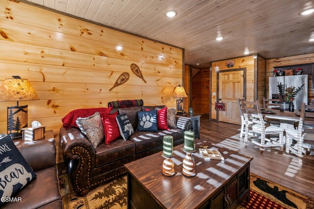 living area with recessed lighting, wood ceiling, wood walls, and wood finished floors